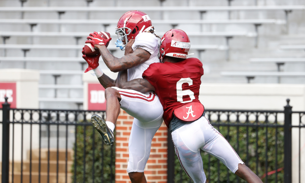 Jameson Williams (No. 1) makes a catch in Alabama practice against Khyree Jackson
