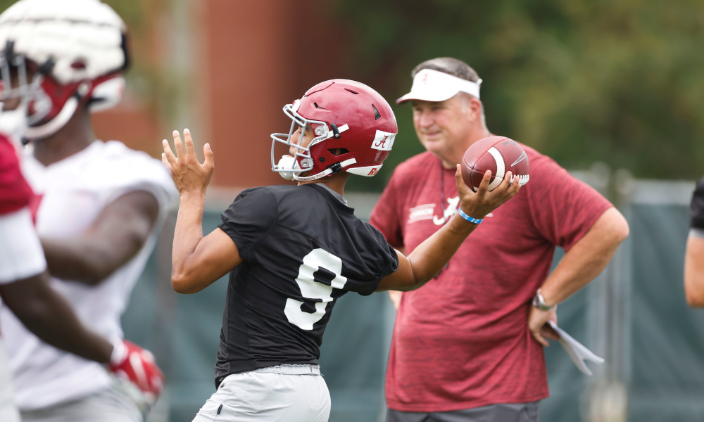 Bryce Young throws a pass in Alabama fall camp practice