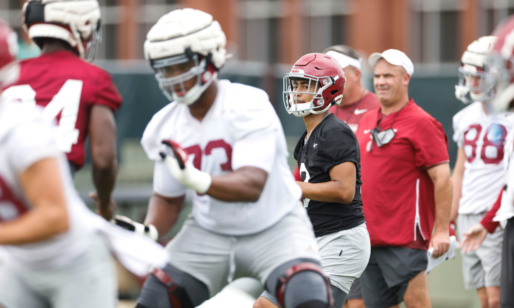 Bryce Young drops back in the pocket with the ball at Alabama practice