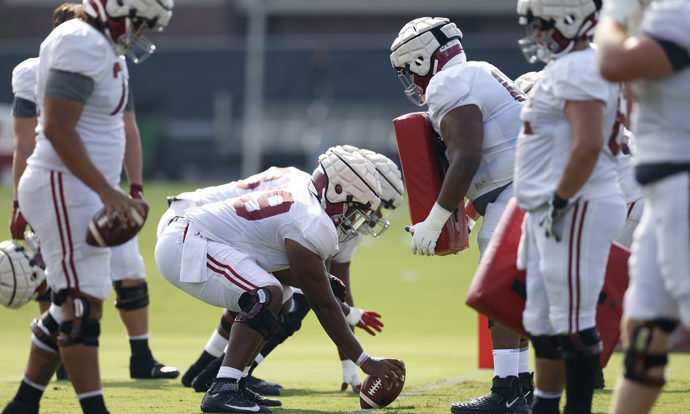 Chris Owens prepares for a snap at Alabama practice