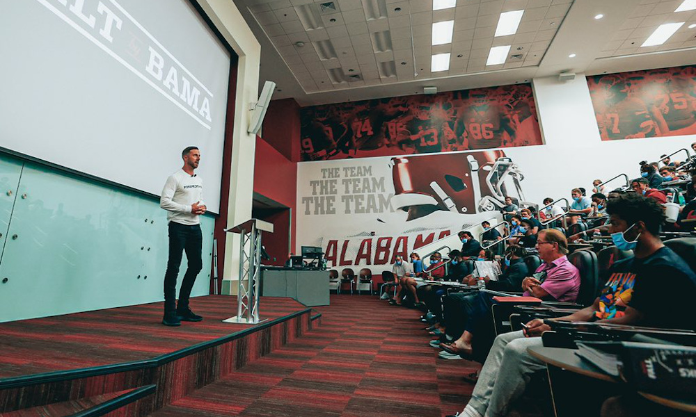 Former NFL quarterback, Alex Smith speaks to Alabama team during fall camp