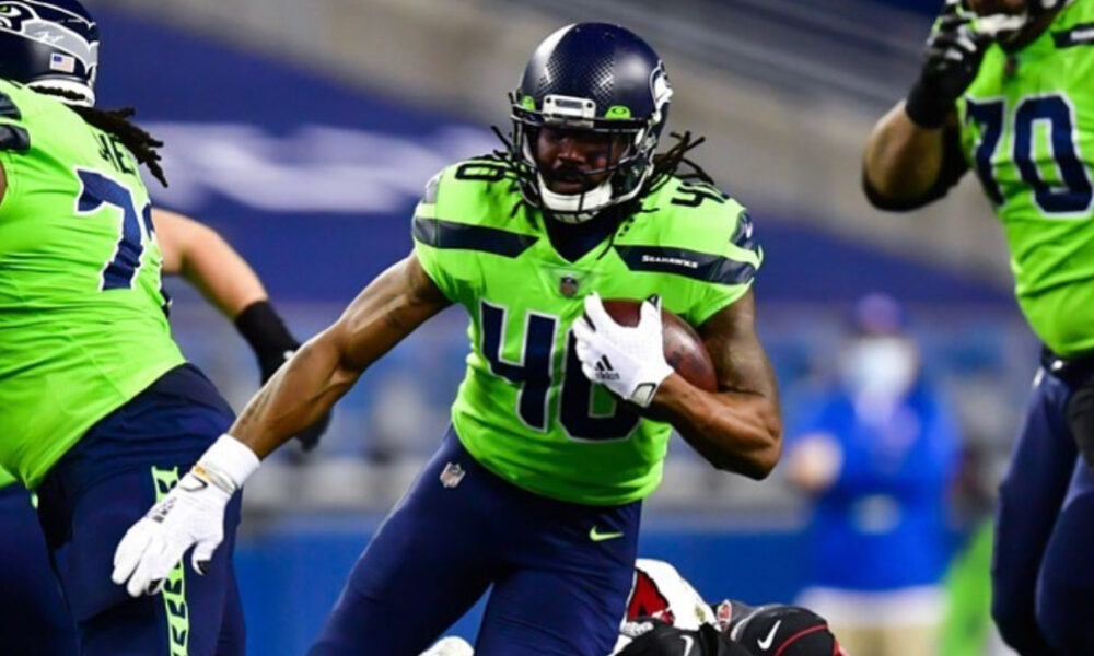 Bo Scarbrough carries the ball for the Seattle Seahawks