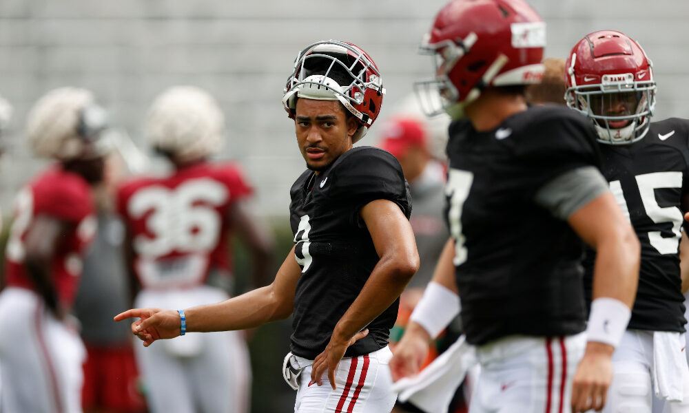 Bryce Young looks to the quarterbacks with helmet off