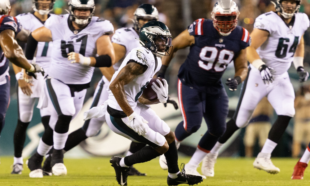 DeVonta Smith runs with the ball for Eagles versus Patriots
