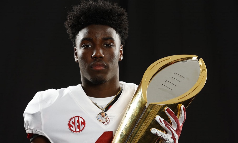 Denver Harris holds Alabama trophy during Alabama visit