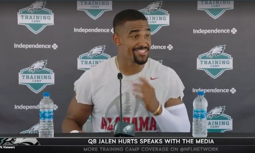 Jalen Hurts sports an Alabama football shirt at Eagles press conference