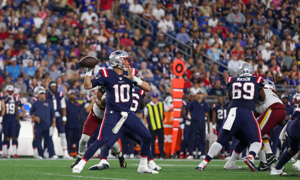Mac Jones throws a pass for Patriots in NFL Preseason Game versus Washington