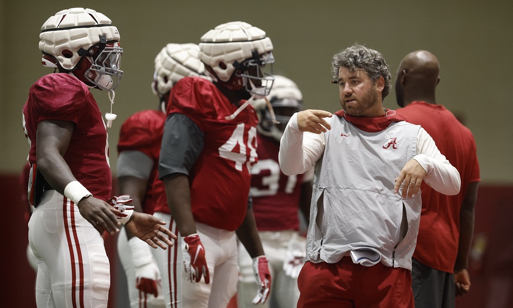 Pete Golding coaching Alabama's defensive players during practice
