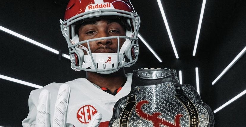 Shazz Preston poses with Alabama turnover belt during visit