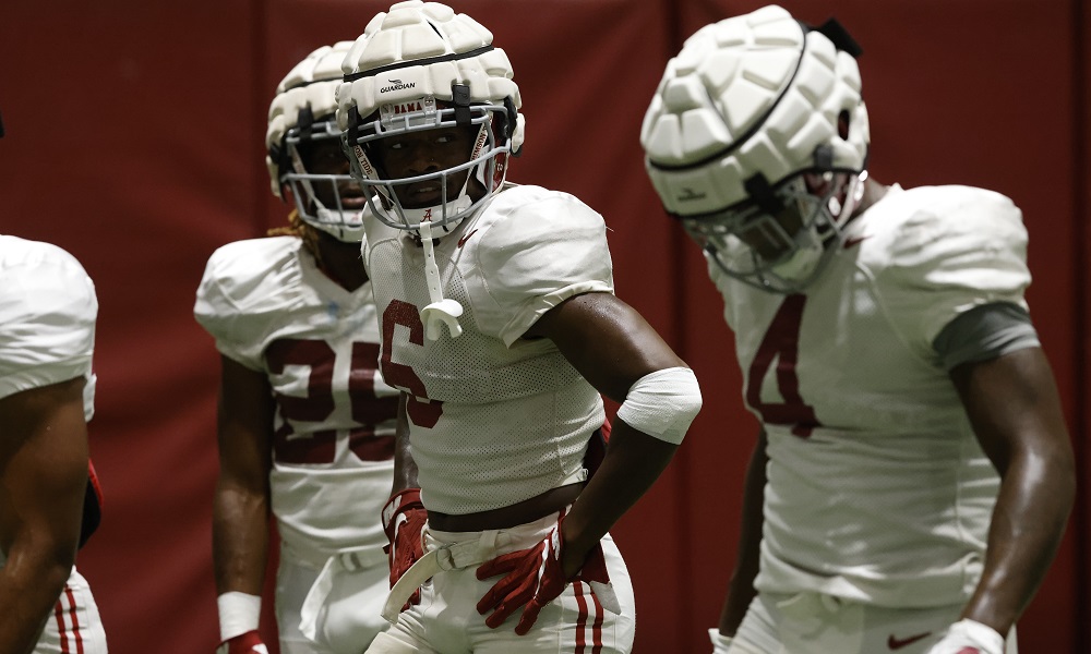 Trey Sanders (No. 6) going through running back drills in practice for Alabama