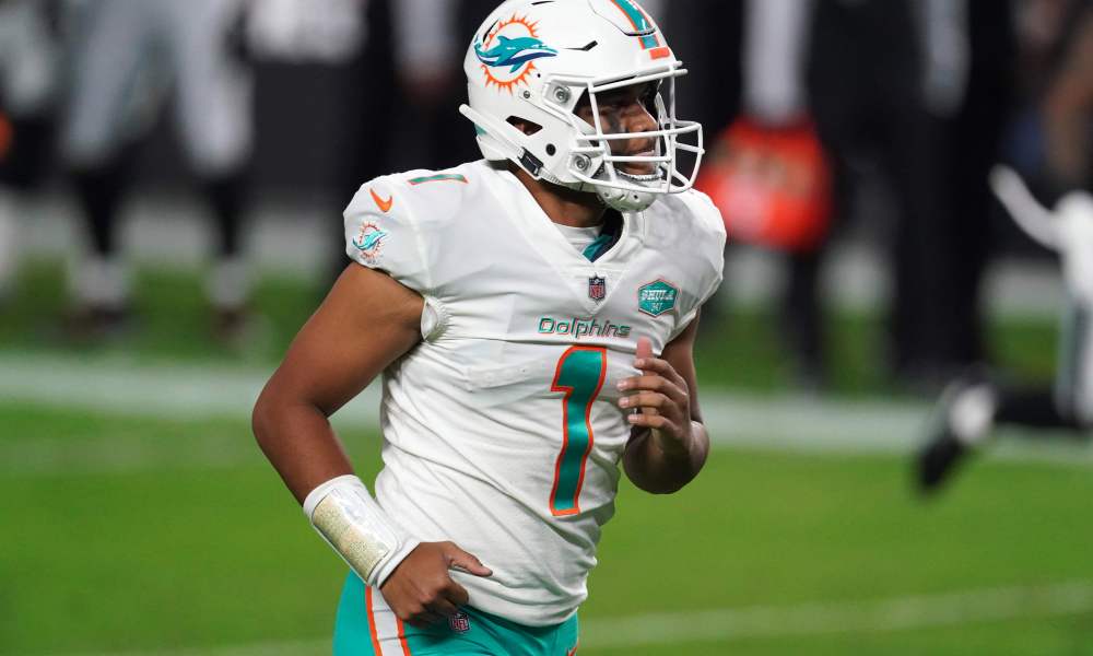Tua Tagovailoa jogs off the field in 2020 after Dolphins defeat Raiders