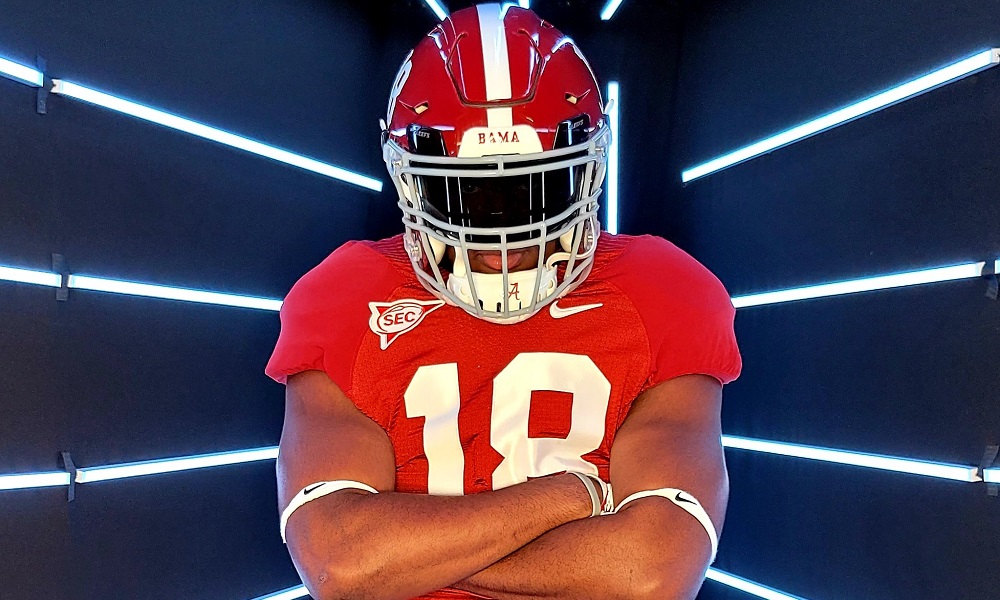 5-Star DE Jayden Wayne poses in Alabama uniform during visit