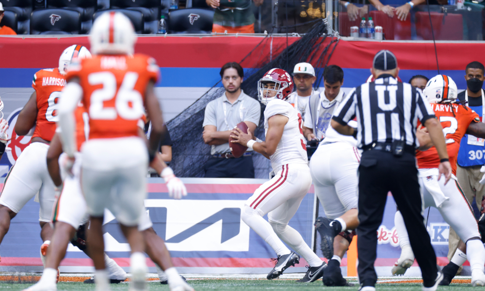 Bryce Young attempts a throw in the pocket for Alabama versus Hurricanes