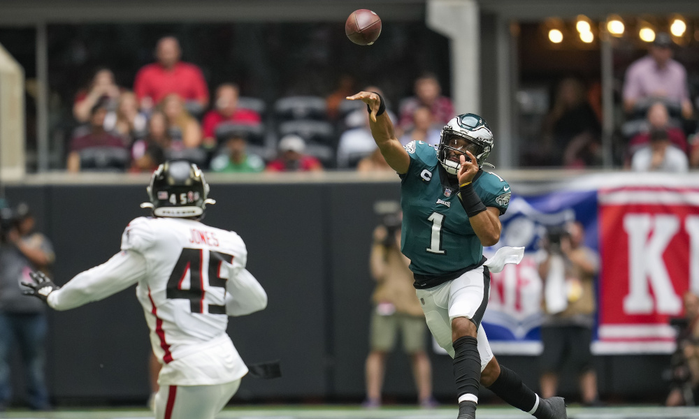 Jalen Hurts with a pass on the run for Eagles versus Falcons