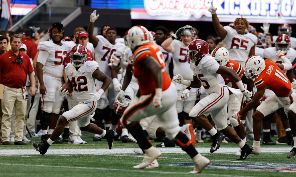 Jaylen Moody (#42) returns an interception for Alabama versus Miami