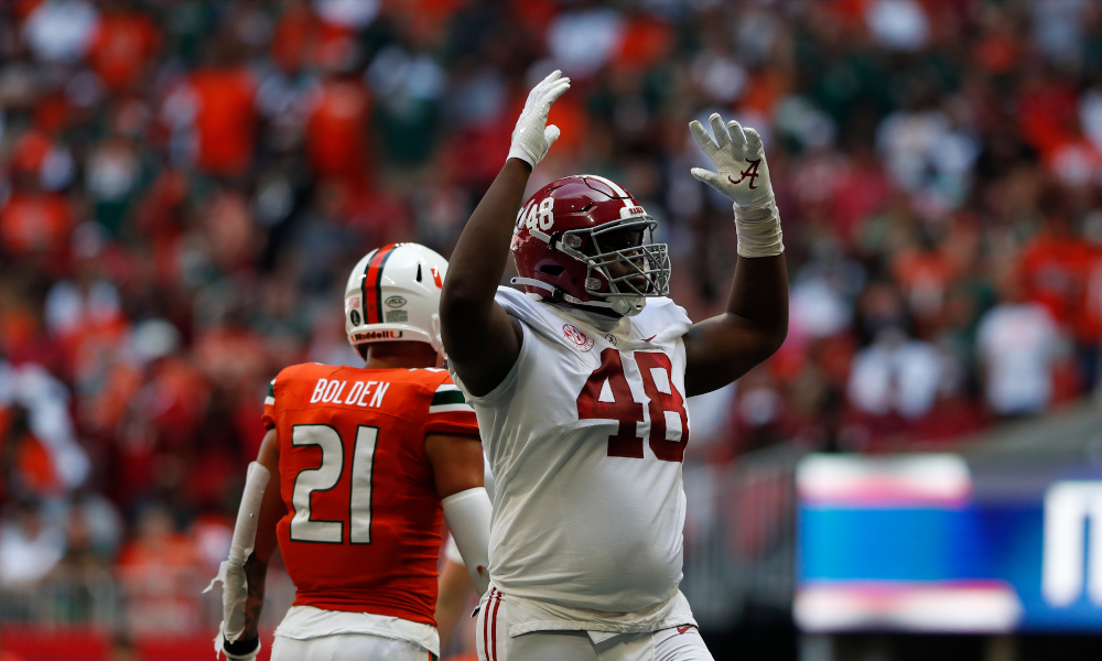 Phidarian Mathis (No. 48) celebrates a big play for Alabama's defense versus Miami