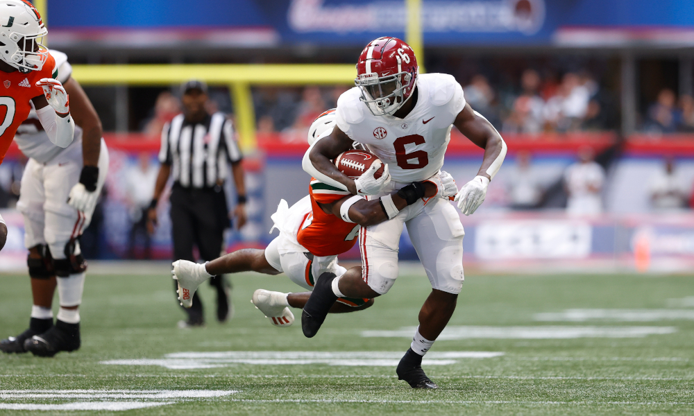 Trey Sanders (#6) breaks a tackle for Alabama versus Miami