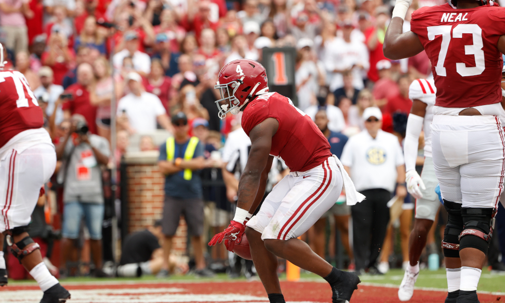 Brian Robinson Jr. (#4) celebrates rushing TD for Alabama versus Ole Miss