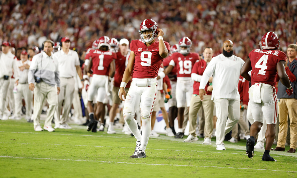 Bryce Young (#9) walks on the field for Alabama versus Tennessee after a timeout