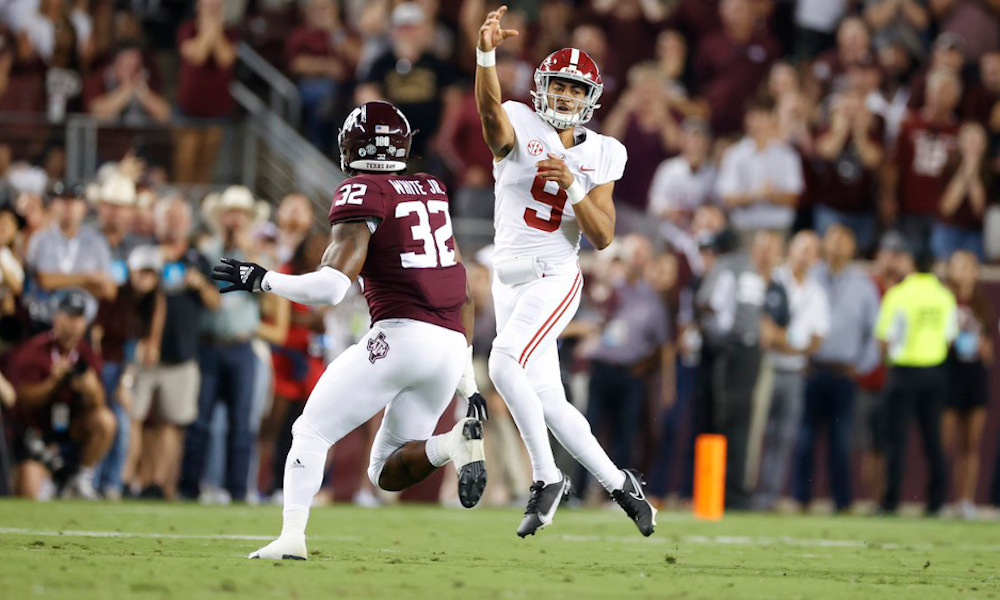 Bryce Young (#9) throws a pass for Alabama versus Texas A&M