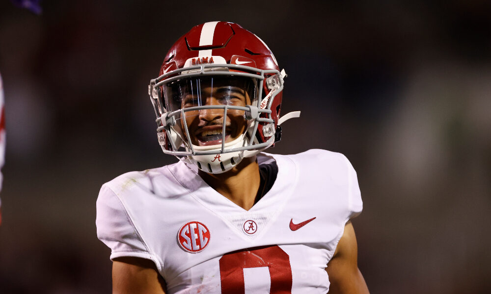 Bryce Young smiles on the field against Mississippi State