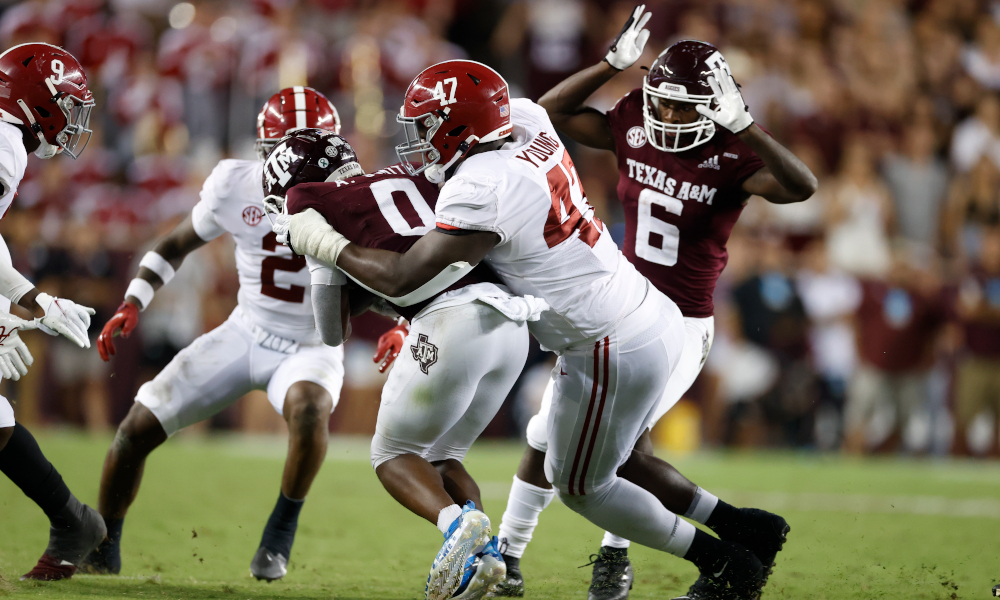 Byron Young (#47) tackles Texas A&M receiver Ainias Smith