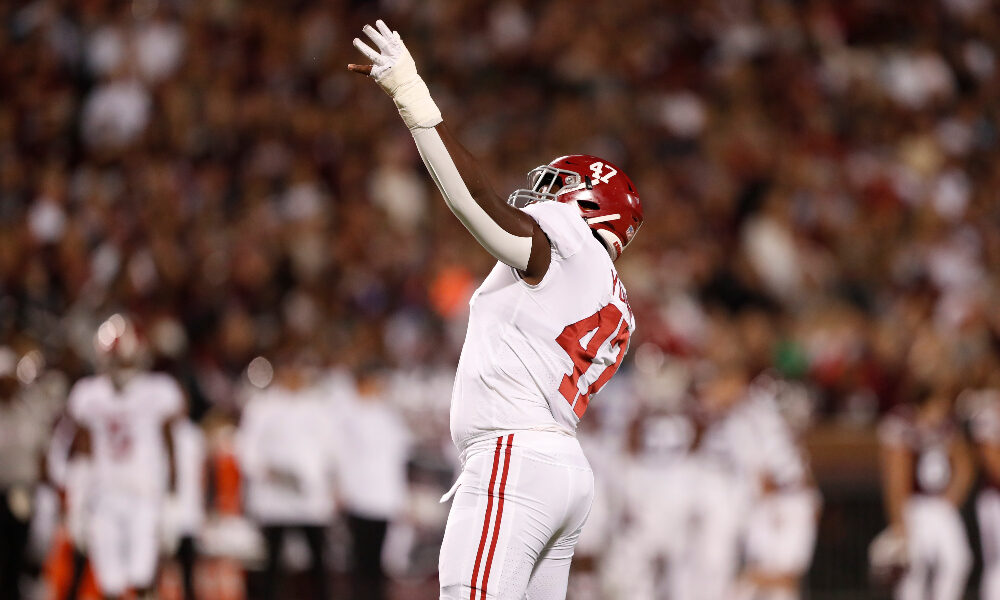 Byron Young celebrates a sack against Mississippi State