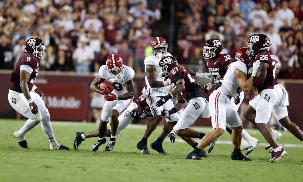 John Metchie (#8) with the ball for Alabama versus Texas A&M