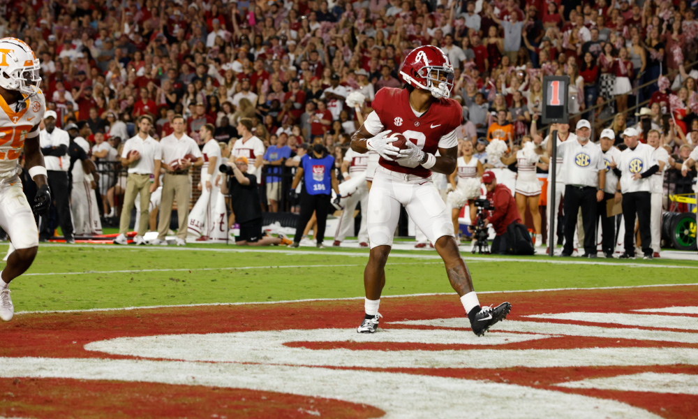 John Metchie (#8) scores a touchdown for Alabama versus Tennessee
