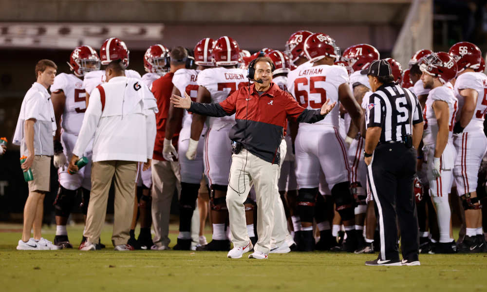 Nick Saban talking to an official on the sideline versus Miss. State