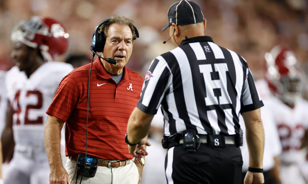 Nick Saban talks to an official against Texas A&M