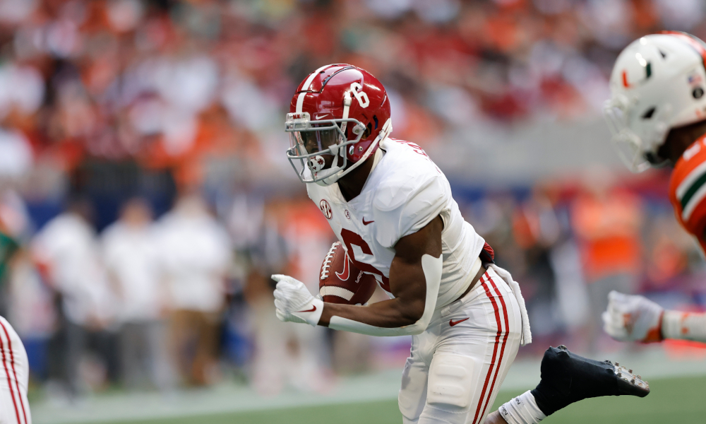 Trey Sanders (#6) runs the ball for Alabama versus Miami