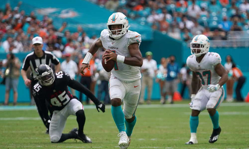 Tua Tagovailoa (#1) runs with football for Dolphins versus Falcons