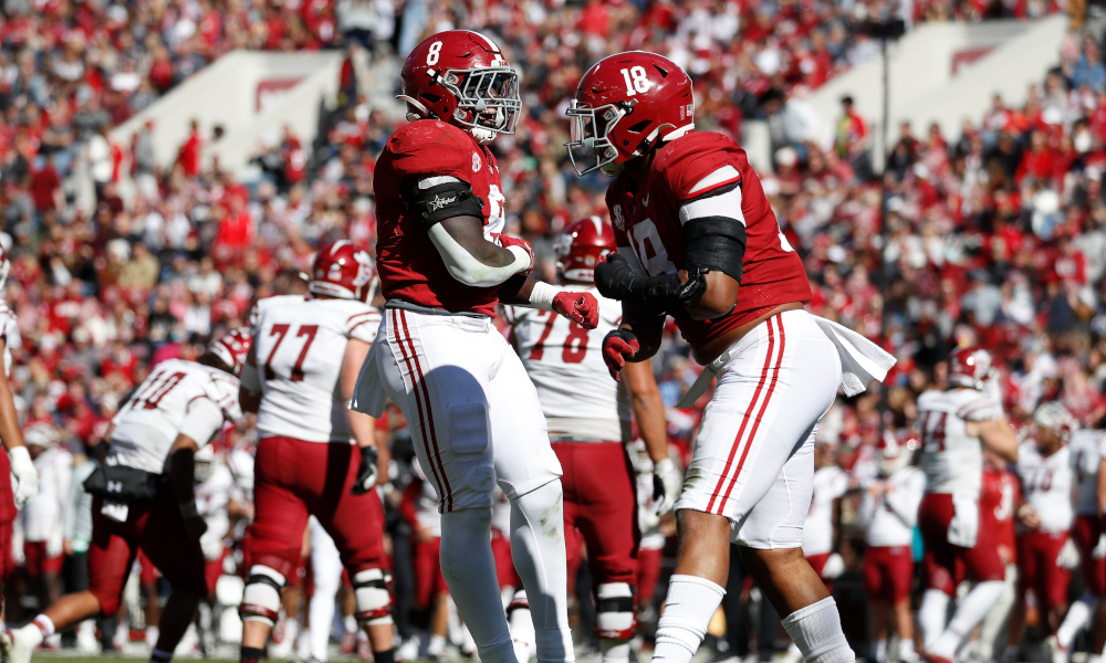 Christian Harris (#8) and LaBryan Ray (#18) celebrate a big play for Alabama versus New Mexico State