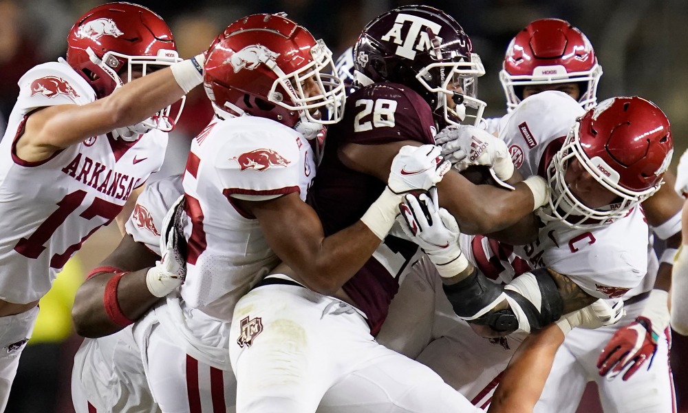 Alabama's defensive front tackles Isaiah Spiller (#28) of Texas A&M in 2021 season