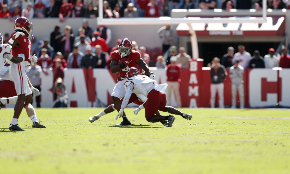 Brian Robinson (#4) breaks a tackle for Alabama versus New Mexico State