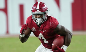 Brian Robinson carries the ball against Tennessee