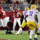 Bryce Young (#9) sets up to throw for Alabama versus LSU in 2021