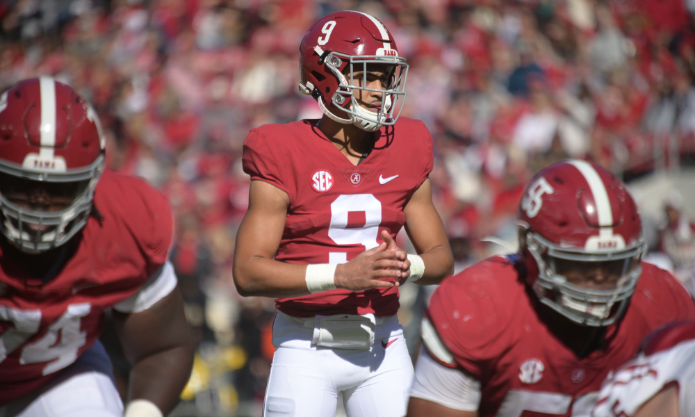 Bryce Young (#9) looks over the formation for Alabama versus New Mexico State