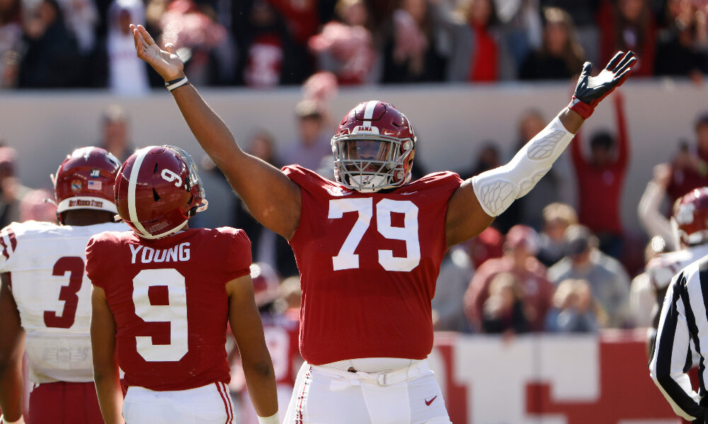 Chris Owens celebrates a touchdown with Bryce Young