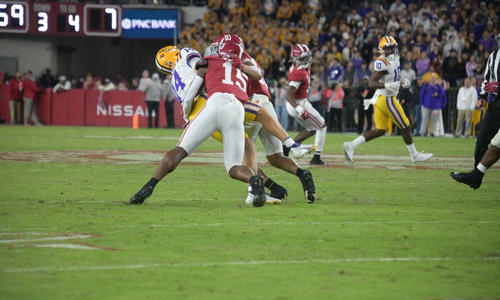 Dallas Turner (#15) tackles LSU quarterback Max Johnson in Alabama's game versus LSU