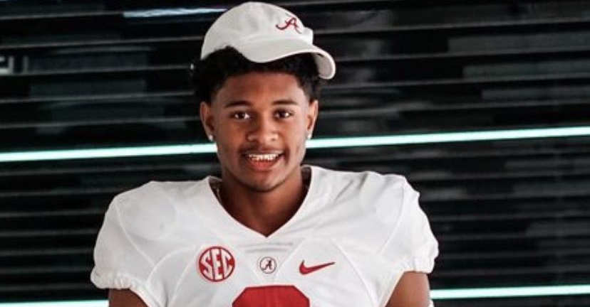 Earl Little Jr. poses with alabama uniform