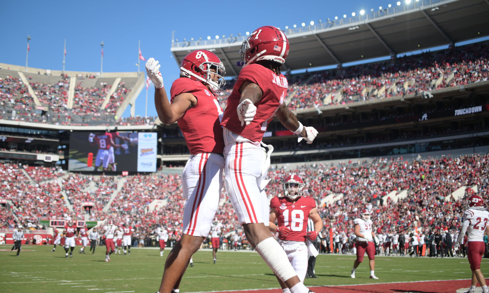 Jameson Williams (#1) and John Metchie (#8) celebrate a touchdown for Alabama versus New Mexico State