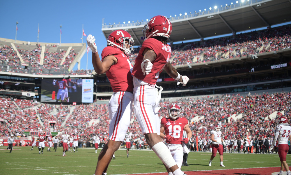 Alabama center Chris Owens (79), receiver John Metchie III (8