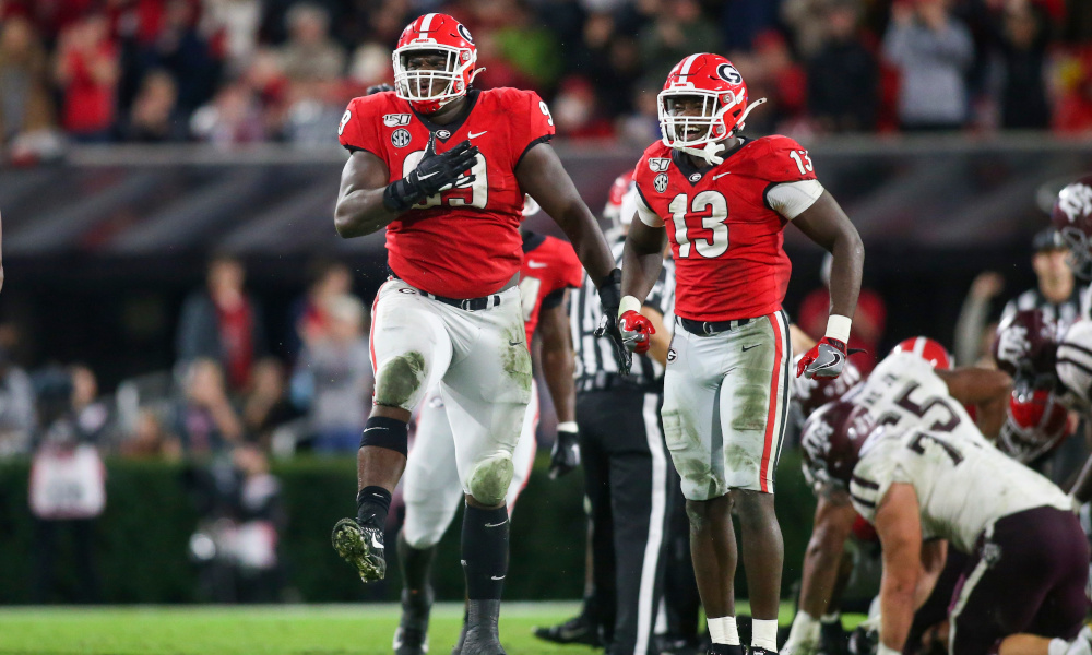 Jordan Davis (#99) celebrates a defensive play for Georgia in 2019 versus Texas A&M