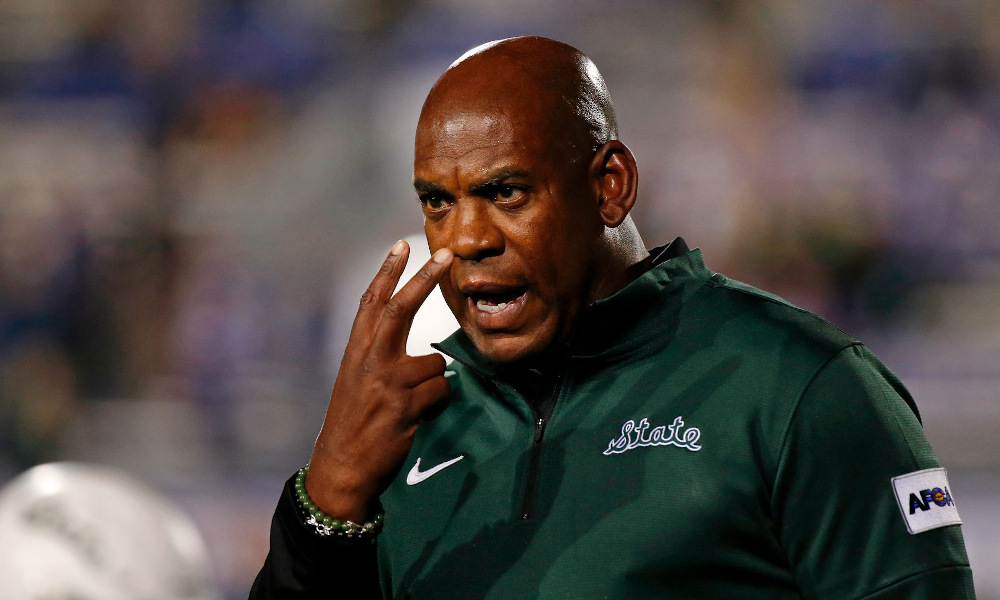 Mel Tucker directing players at Michigan State versus Michigan in 2021 season