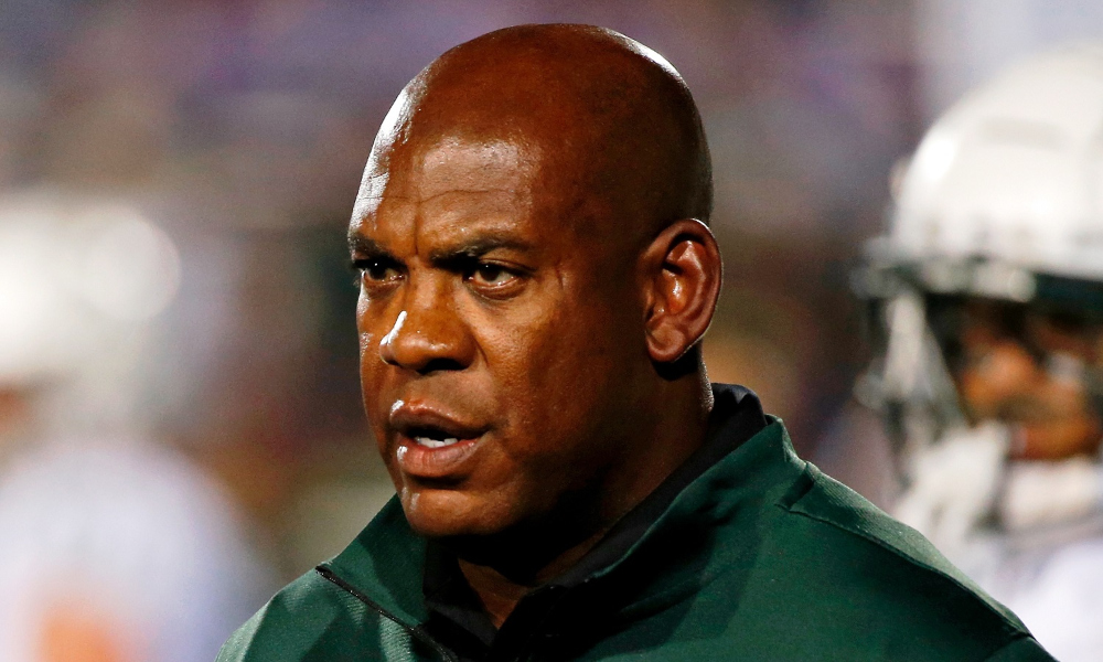 Mel Tucker walks onto the field for Michigan State