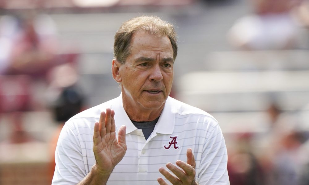 Nick Saban clapping his hands on the field before Alabama faces New Mexico State