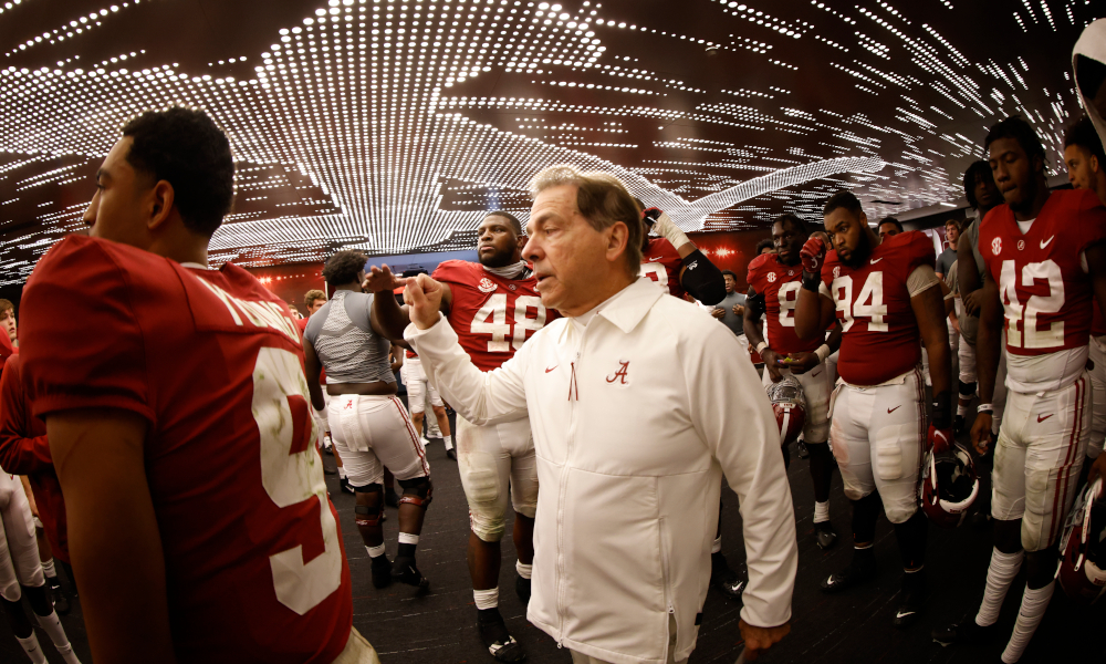 Nick Saban in the locker room with Alabama team after win over Arkansas