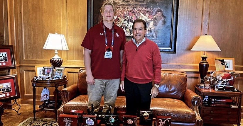 Olaus Alinen takes picture with Nick Saban during Alabama visit